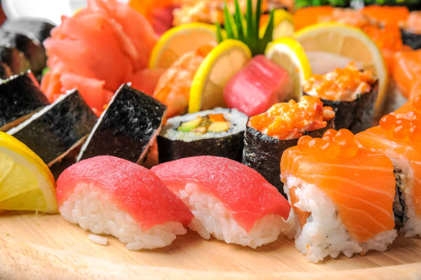 istock Nigiri sushi and  rolls with fish served on wooden table 638457174