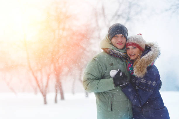 istock Happy Young Couple in Winter Park laughing and having fun. 638457494