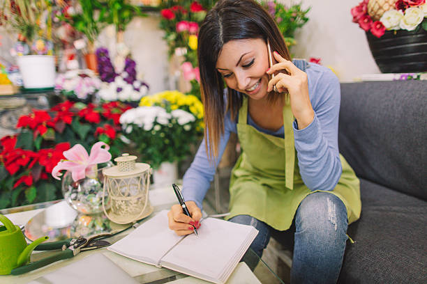 istock Florist taking orders on the phone 638457990