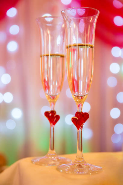 istock Wedding glasses with red hearts 638461734