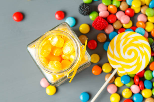 istock Assorted colorful candies fallen out of jar 638461976