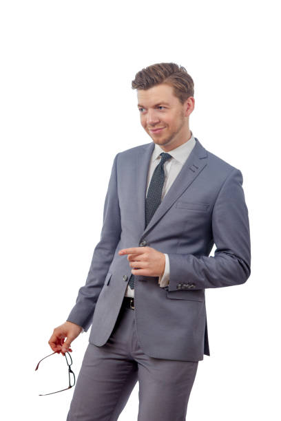 istock man with glasses in a tie smiling and pointing her 638463536