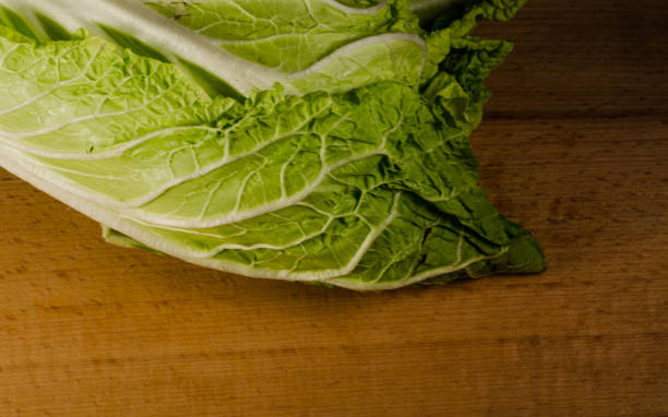 istock Chinese cabbage on a wooden table 638466468