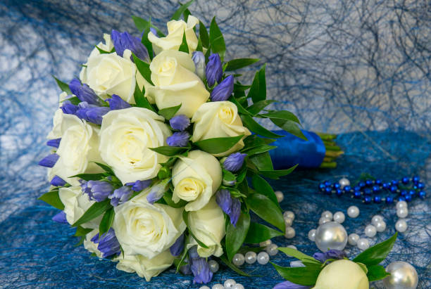 istock Wedding bouquet with roses on blue sisal 638469574