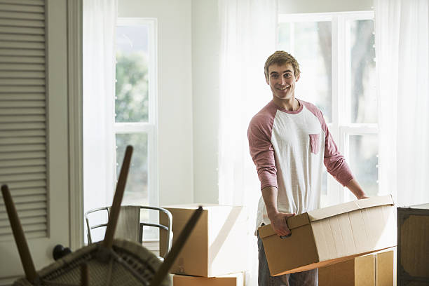 istock Young man moving into house or apartment 638469688