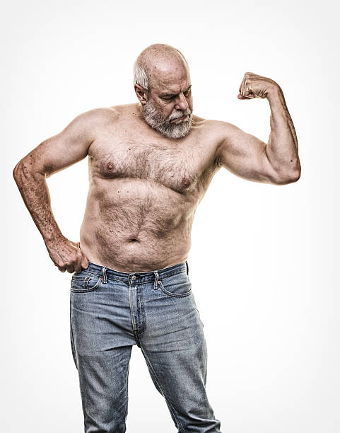 real person real body senior man flexing left arm muscles - abdominal muscle muscular build men torso photos et images de collection