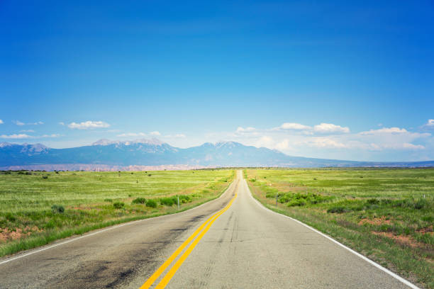 istock Deserted valley road  going to the horizon. 638473484