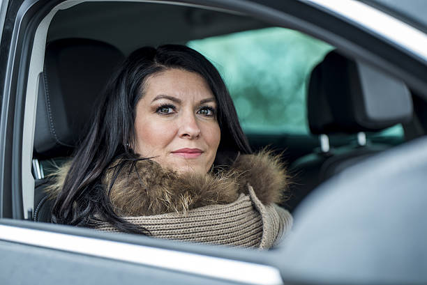 istock Beautiful woman in car 638474016