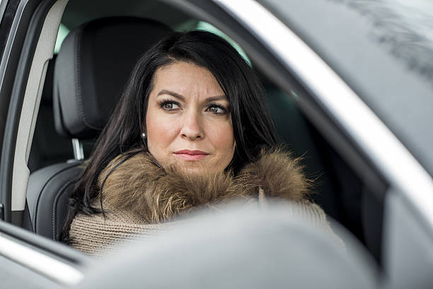 istock Beautiful woman in car 638474140