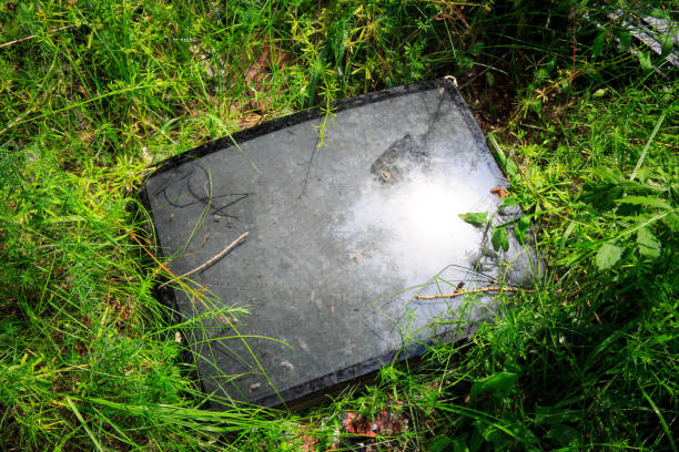 istock broken television tube in green grass 638474462