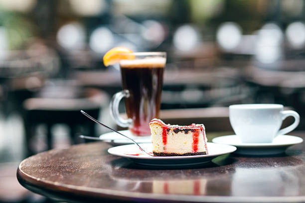 istock Slice of cheesecake with cherry and cup tea 638476532