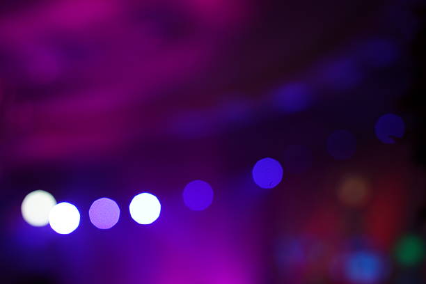 Defocused entertainment concert lighting on stage, blurred disco party and Concert Live.