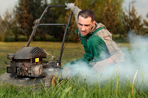 Exploit, old lawn mower and the cloud of exhaust fumes