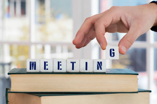 istock MEETING Concept , Hand with alphabet blocks 638477858