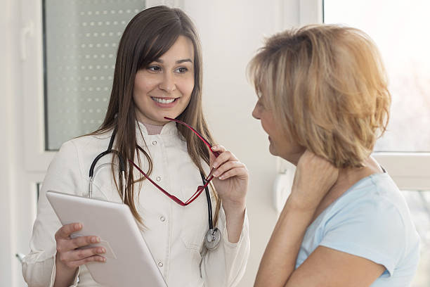 istock Female doctor with patient 638477948