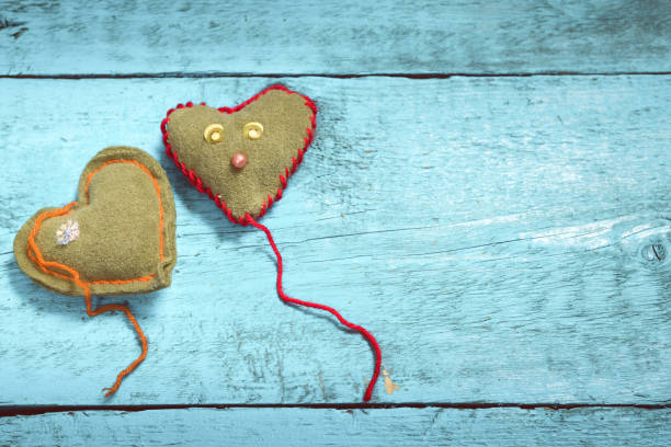 istock Colorful knitted hearts on the light blue boards 638478178