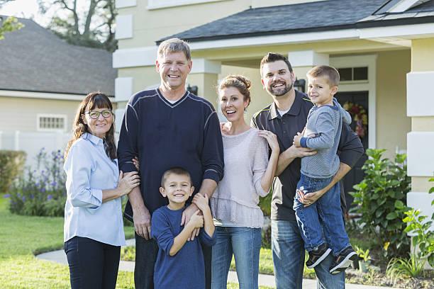 istock Multi-generation family portrait outside house 638479746