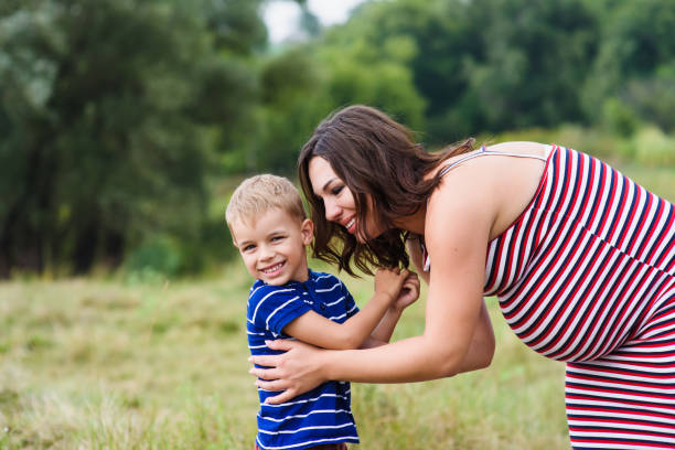 istock Happy pregnant mom and her son 638479944