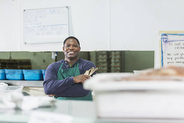 istock African American man working in fish market 638480074