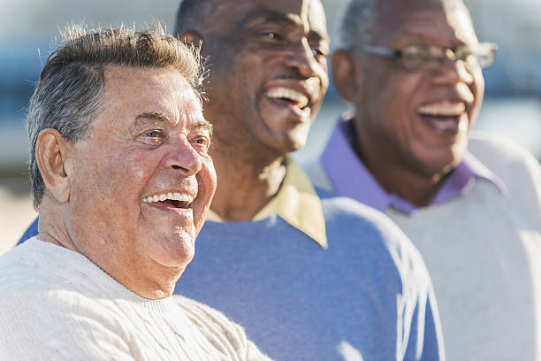istock Faces of three multi-ethnic senior men laughing 638480416