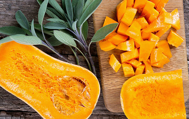 istock butternut squash on wooden background 638480436