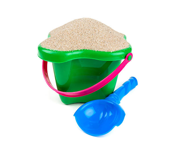 istock beach sand, shovel and bucket 638480496