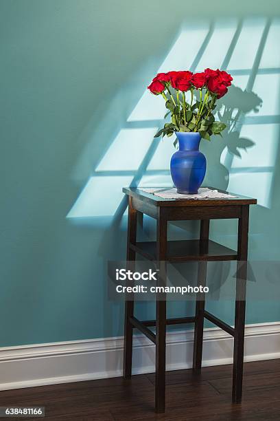 Window Light Shining On A Dozen Red Roses On Table Stock Photo - Download Image Now - Anniversary, Birthday, Birthday Present