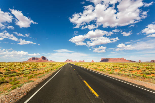 istock Monument valley road going to the horizon 638482852