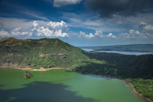 Shot looking down into the water filled caldera of Volcano Island, surrounded by the waters of Taal Lake in Luzon Province, The Philippines.