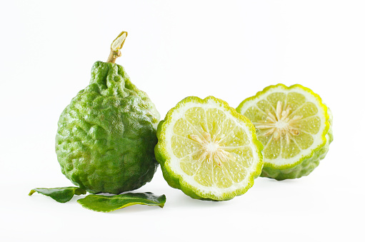 Green rough peel bergamot fruit or kaffir lime isolated on white background