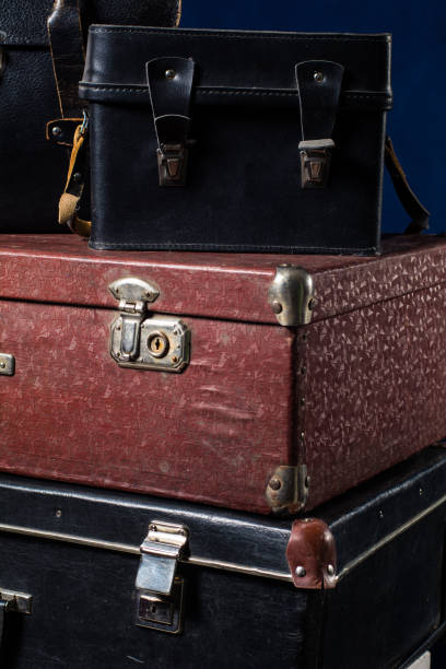 istock Close-up of a stack vintage shabby suitcases 638485496