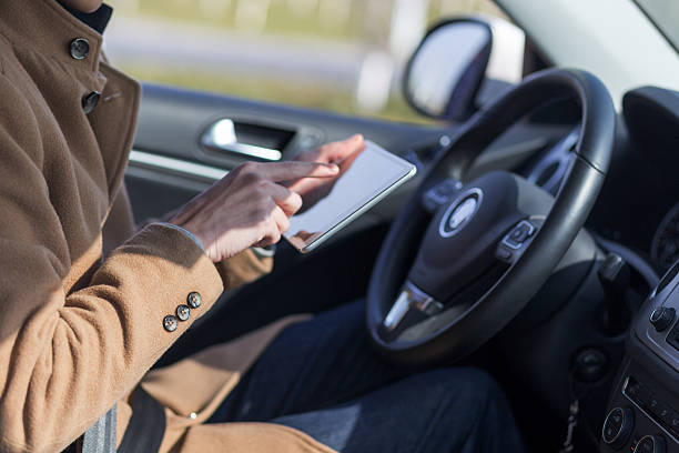 istock young asian man  hold tablet in car 638485970