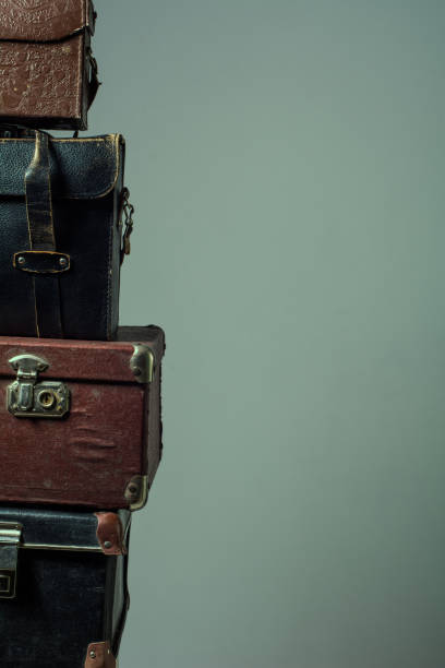 istock Background stack of old shabby suitcases form a tower 638486154