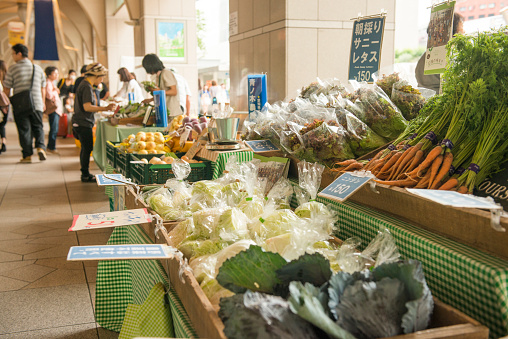 Graz, Austria - August 26, 2023: Stall with vegetables greens and fruit at the farmer's market in Kaiser-Josef-Platz