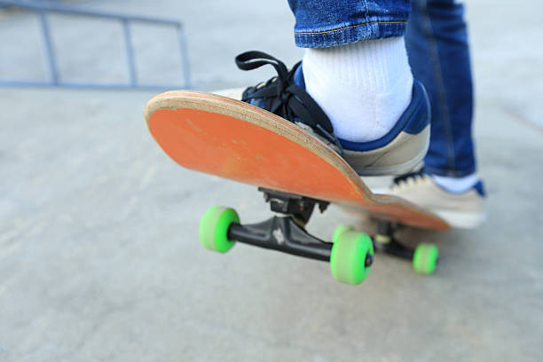 istock young skateboarder legs skateboarding at skatepark 638488322