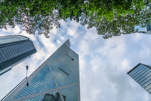 Bank of China Tower and green trees at daytime,Hong Kong,china.