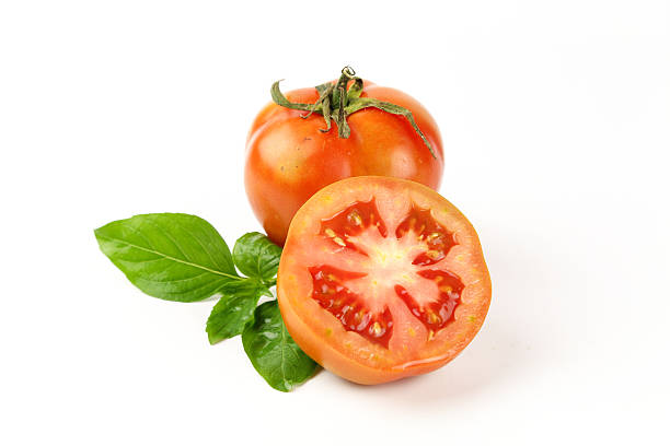 istock fresh tomatoes with green leaves 638490450