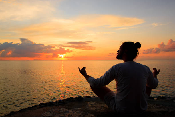 istock Yoga scene silhouette in sunset. 638490732