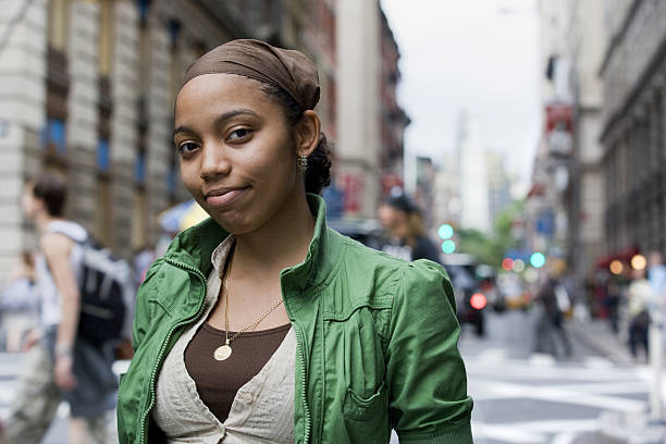 Portrait of young Hispanic woman in downtown city Portrait of young Hispanic woman in downtown city, New York City do rag stock pictures, royalty-free photos & images