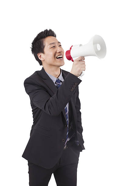 istock Young Businessman Holding Megaphone 638491360