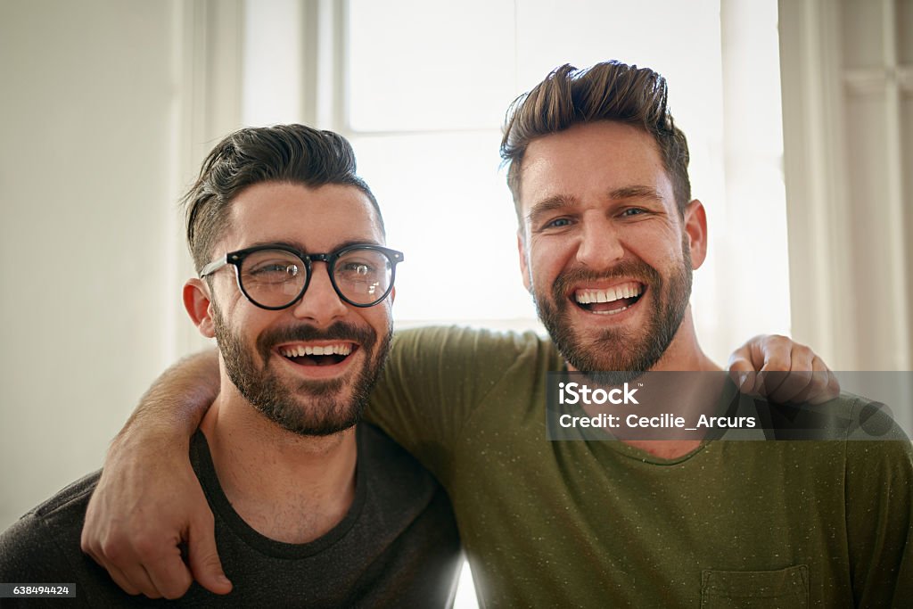 Brother's in business Portrait of two happy colleagues working together in a creative office Friendship Stock Photo