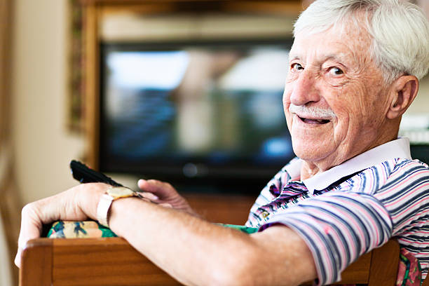 istock 90-year-old man laughs; he's got the TV remote control! 638498254