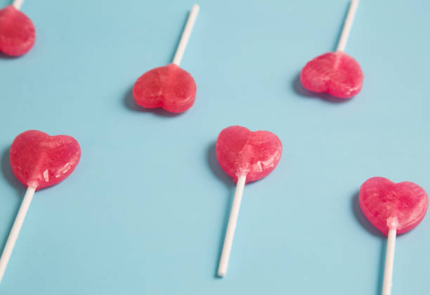 istock Heart lollipop on blue background.Minimal concept. 638500478