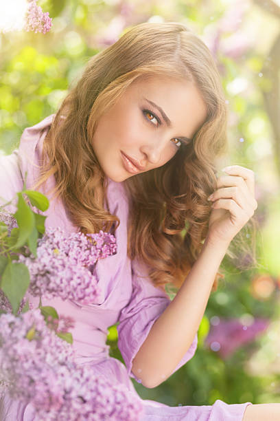istock Girl and lilac flowers 638503704