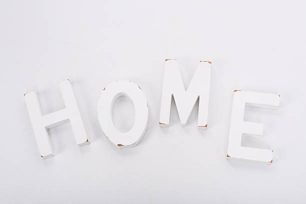 istock Decorative letters forming word HOME on white background. Rustic interior 638504944