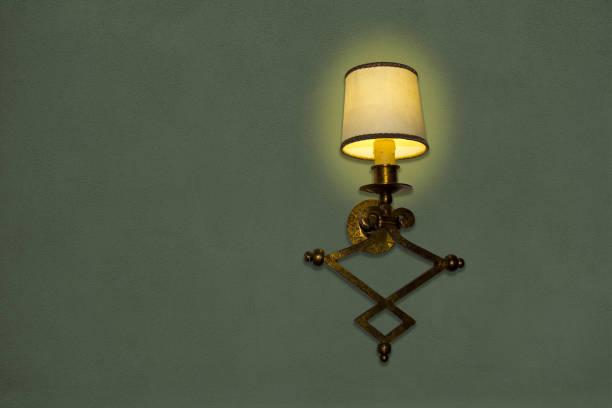 istock Old wall lamp made of metal with shade from canvas 638506800