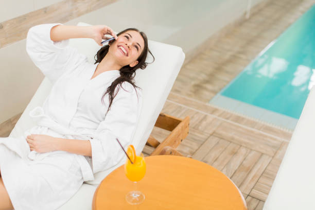 istock Young woman by the pool 638506970