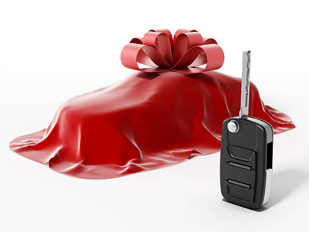 Covered car wrapped with ribbon and car key