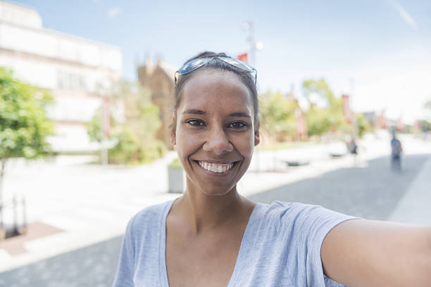 Aboriginal woman taking selfie - POV