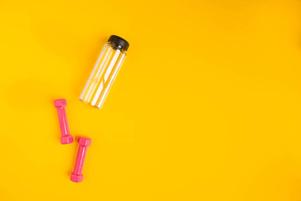 istock dumbbells and water bottle set from above view 638511512